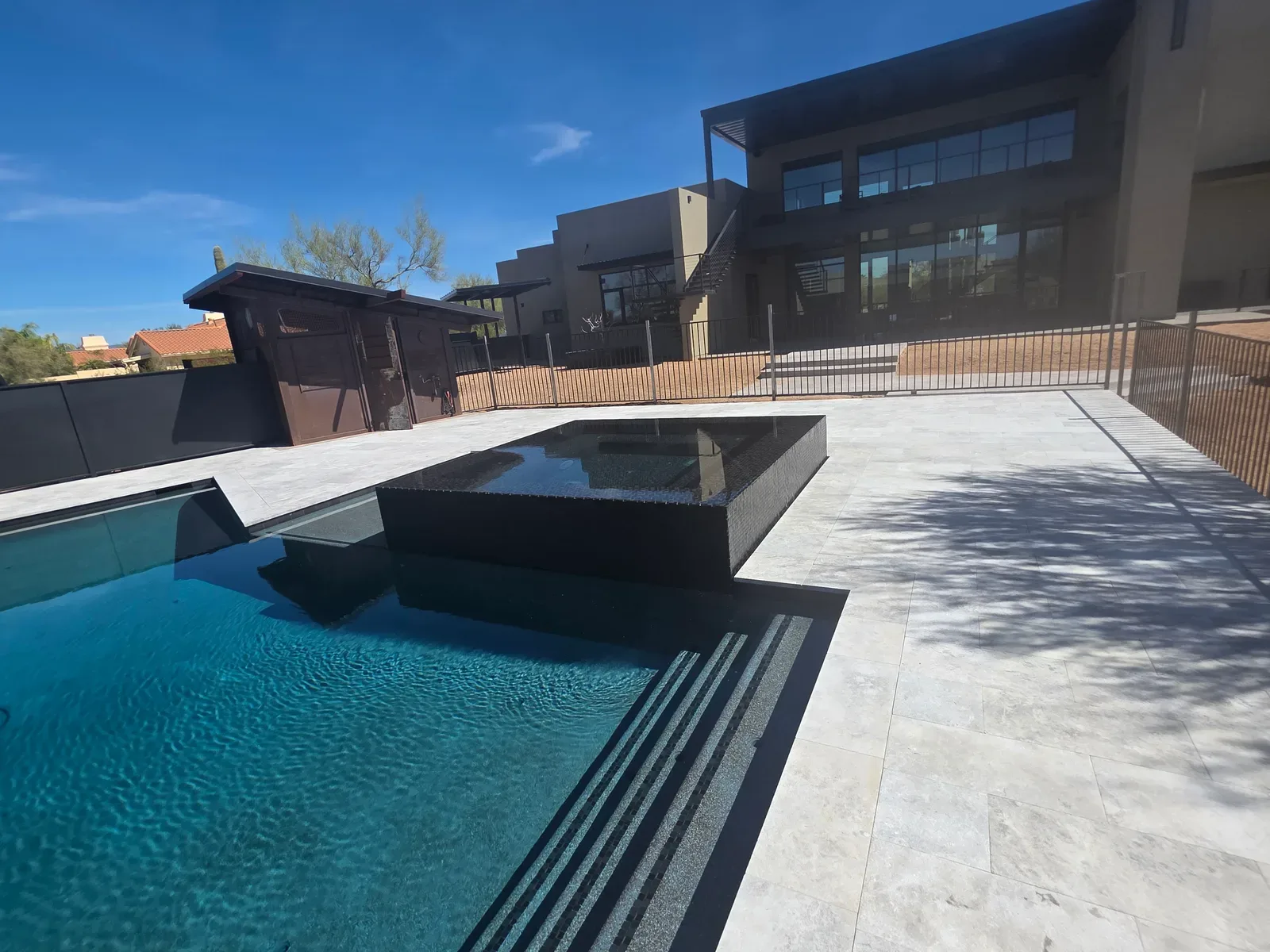 Perimeter overflow pool by DCM Pools
