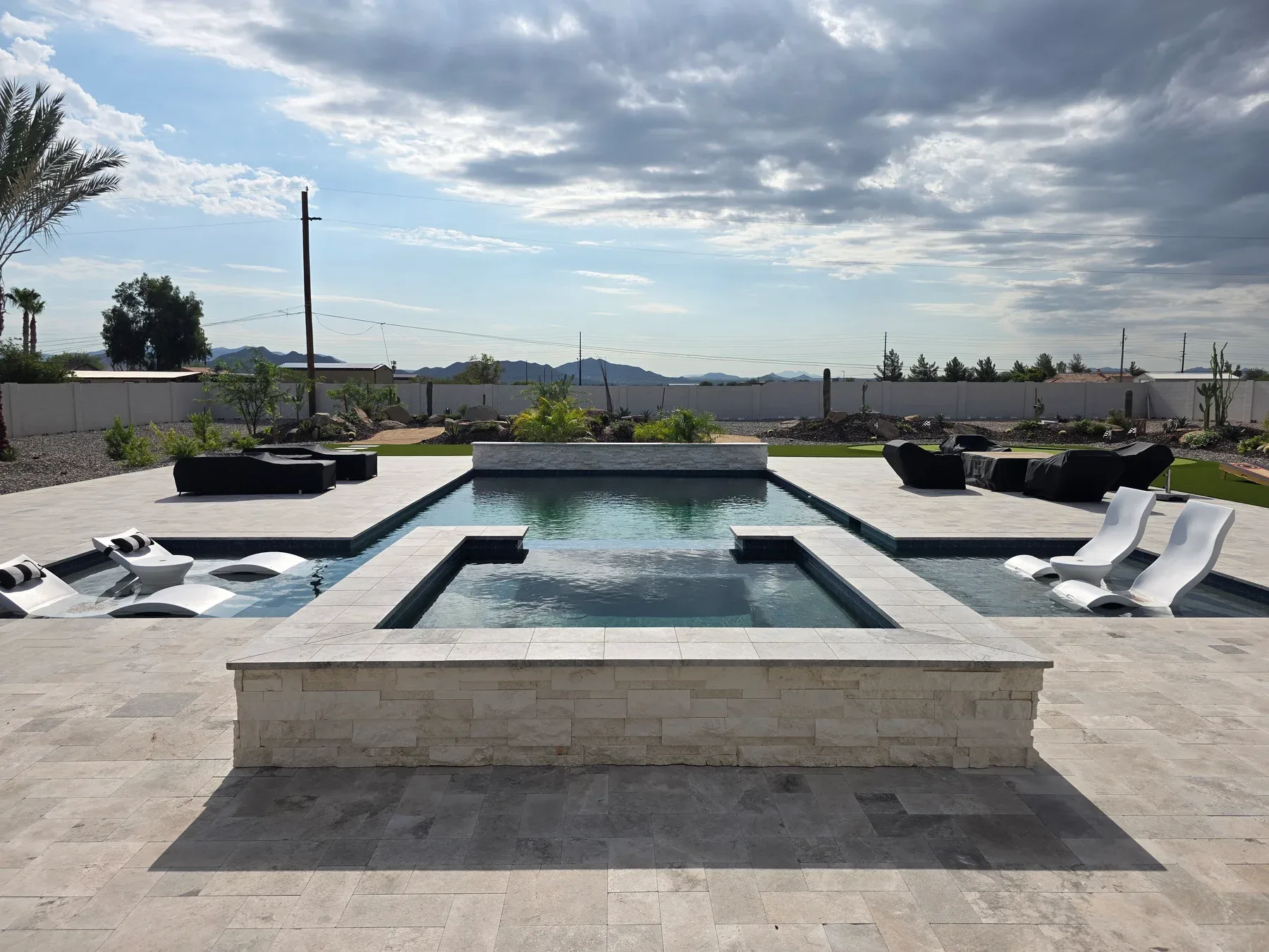 Baja shelf pool with spa by DCM Pools