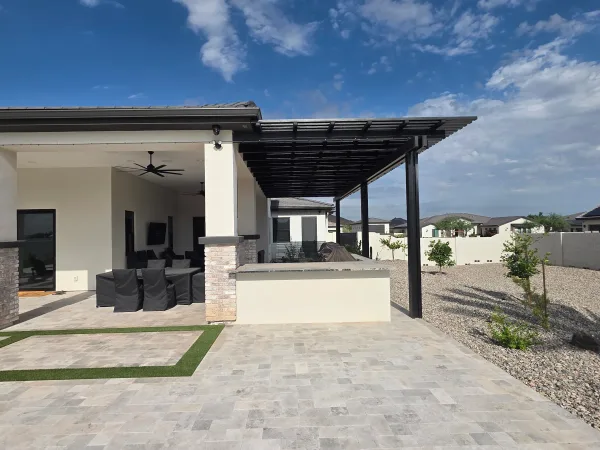 Pergola and travertine patio by DCM Pools — Arizona
