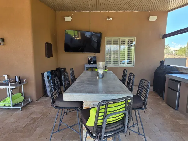 Outdoor kitchen with built-in grill — DCM Pools and Construction
