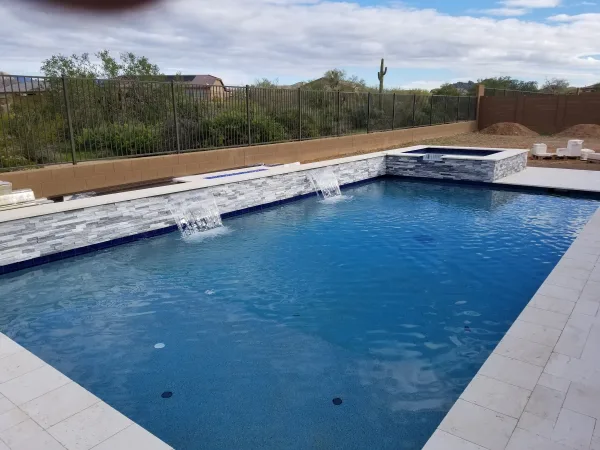Pool with spa and travertine deck — DCM Pools Arizona