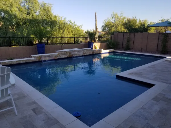 Pool with travertine coping — DCM Pools and Construction