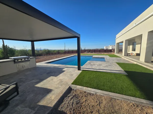 Geometric pool with mosaic tile spa by DCM Pools — Arizona
