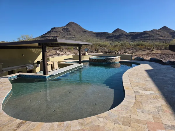 Pool with travertine deck — DCM Pools, Arizona
