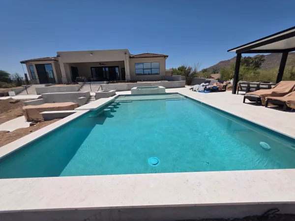 Pool with travertine coping — DCM Pools and Construction