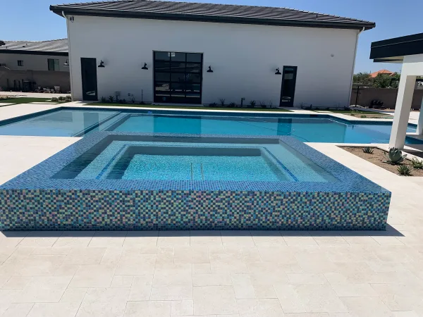 Pool with travertine coping — DCM Pools and Construction