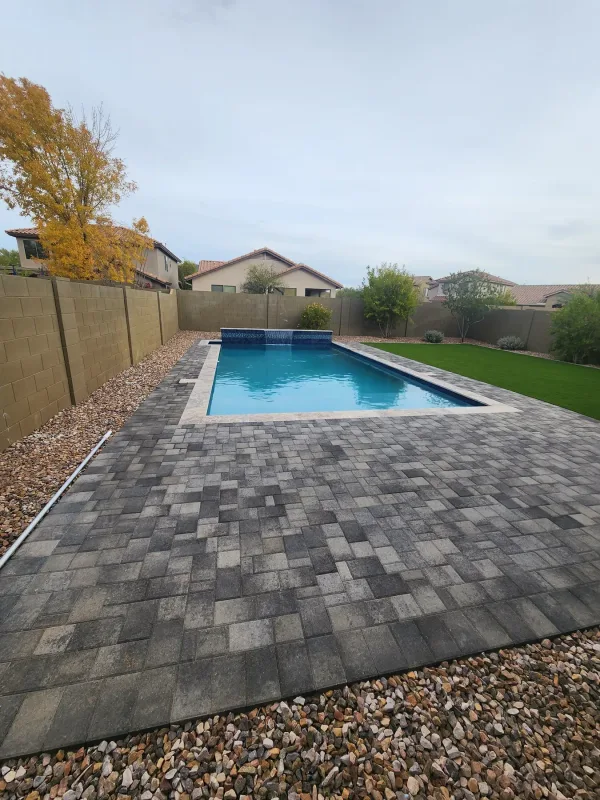 Pool with travertine coping — DCM Pools and Construction
