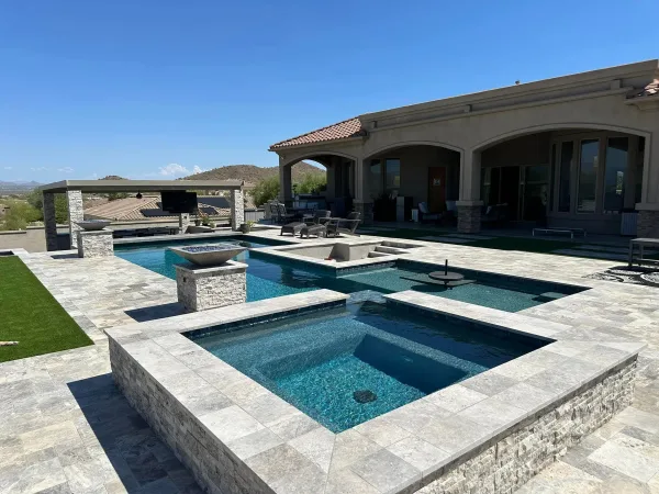 Pool with travertine deck — DCM Pools, Arizona